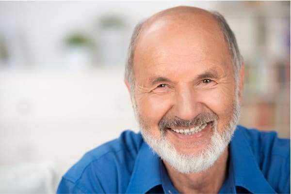 Primary Care - Smiling woman having a conversation with her doctor