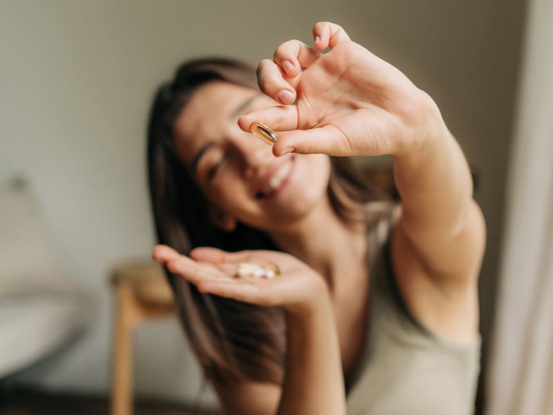 Woman Holding Supplements