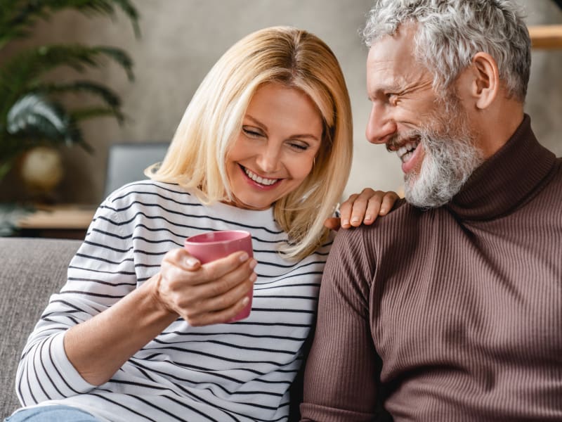 Couple in their 50s relaxing at home