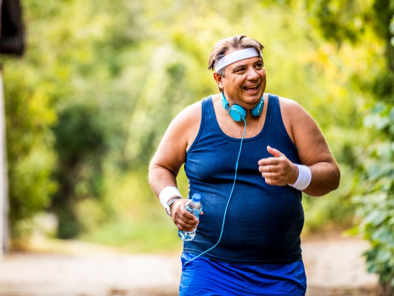 Overweight man jogging